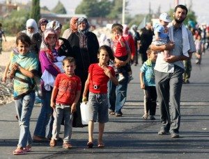 Syrian refugees walk out the container city in Kilis at the border with Syria after clashing with police during a demonstrating over their living conditions on July 22, 2012. AFP PHOTO/ADEM ALTAN