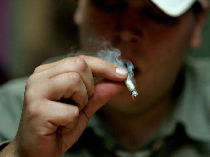 A patient puffs on medicinal marijuana in the San Francisco Patients Cooperative on June 7, 2005 in San Francisco. The Supreme Court dealt a blow to the medical marijuana movement 6/6, ruling that the federal government can still ban possession of the drug in states. (UPI Photo/Terry Schmitt)