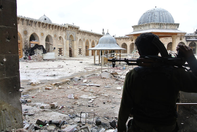 Free Syrian Army 'Al Tawhid' brigade members patrol in the old market (souk) and inside the Great Mosque or the Umayyad Mosque they took only few days ago from Assad regime soldiers, in the center of Aleppo, Syria, on March 16, 2013. The mosque was built in the beginning of the 8th century. And its most 'recent' part was achieved in 1090. The prophet Zacharie's shrine is located inside. The mosque has been partly burned and destroyed during the fights. Photo by Ammar Abd Rabbo/ABACAPRESS.COM