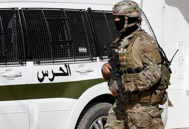 Tunisian security forces are seen near the zone of a raid on a house where gunmen were holed up in Oued Ellil, west of Tunis October 24, 2014. Tunisian security forces on Friday killed six people, including five women, after a standoff with an Islamist militant group on the outskirts of Tunis two days before a parliamentary election, authorities said. REUTERS/Anis Mili (TUNISIA - Tags: MILITARY CIVIL UNREST POLITICS) - RTR4BHG3