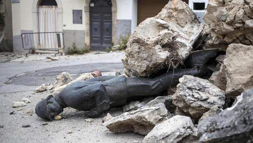 epaselect epa05614088 An unknown soldier monument is buried in rubbles after the strong quake devasted central Italy in San Pellegrino di Norcia, 02 November 2016. Aftershocks continue to keep people on edge in the areas of central Italy devastated by a series of recent earthquakes, including 30 October 6.5-magnitude quake near Norcia. EPA/MASSIMO PERCOSSI