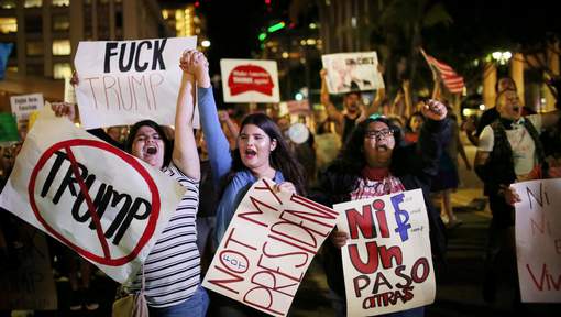 Demonstrators walk through Downtown San Diego in protest to the election of Republican Donald Trump as the president of the United States in San Diego, California, U.S. November 9, 2016. REUTERS/Sandy Huffaker TEMPLATE OUT