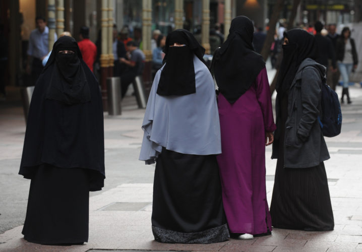 **FILE** A May 17, 2010 file photo of women wearing the niqab whilst participating in a flash mob protest in Sydney. Labor says Tony Abbott's anti-burqa comments are "dumb" and send the message that some people don't fully belong in Australia. (AAP Image/Dean Lewins) NO ARCHIVING
