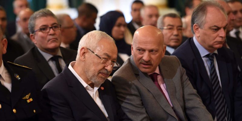 Tunisian Islamist Ennahdha party leader, Rached Ghannouchi (C-L), talks with Vice-President of Nidaa Tounes Ridha Belhaj (C-R) during a ceremony marking the 60th anniversary of Tunisia's independence at the Carthage palace in Tunis, on March 20, 2016, as the country reels from a series of deadly jihadist attacks that have battered its already struggling economy. Last year, IS claimed attacks on the Bardo museum in Tunis and a popular resort hotel, killing 59 tourists in total, and the suicide bombing of a bus that killed 12 presidential guards. On March 7, 2016 dozens of jihadists mounted a dawn assault on security installations in Ben Guerdane, which is near the border with unrest-plagued Libya. On March 19 Tunisian authorities said two "terrorists" were killed close to the southern town of Ben Guerdane near the border with Libya. / AFP / FETHI BELAID (Photo credit should read FETHI BELAID/AFP/Getty Images)